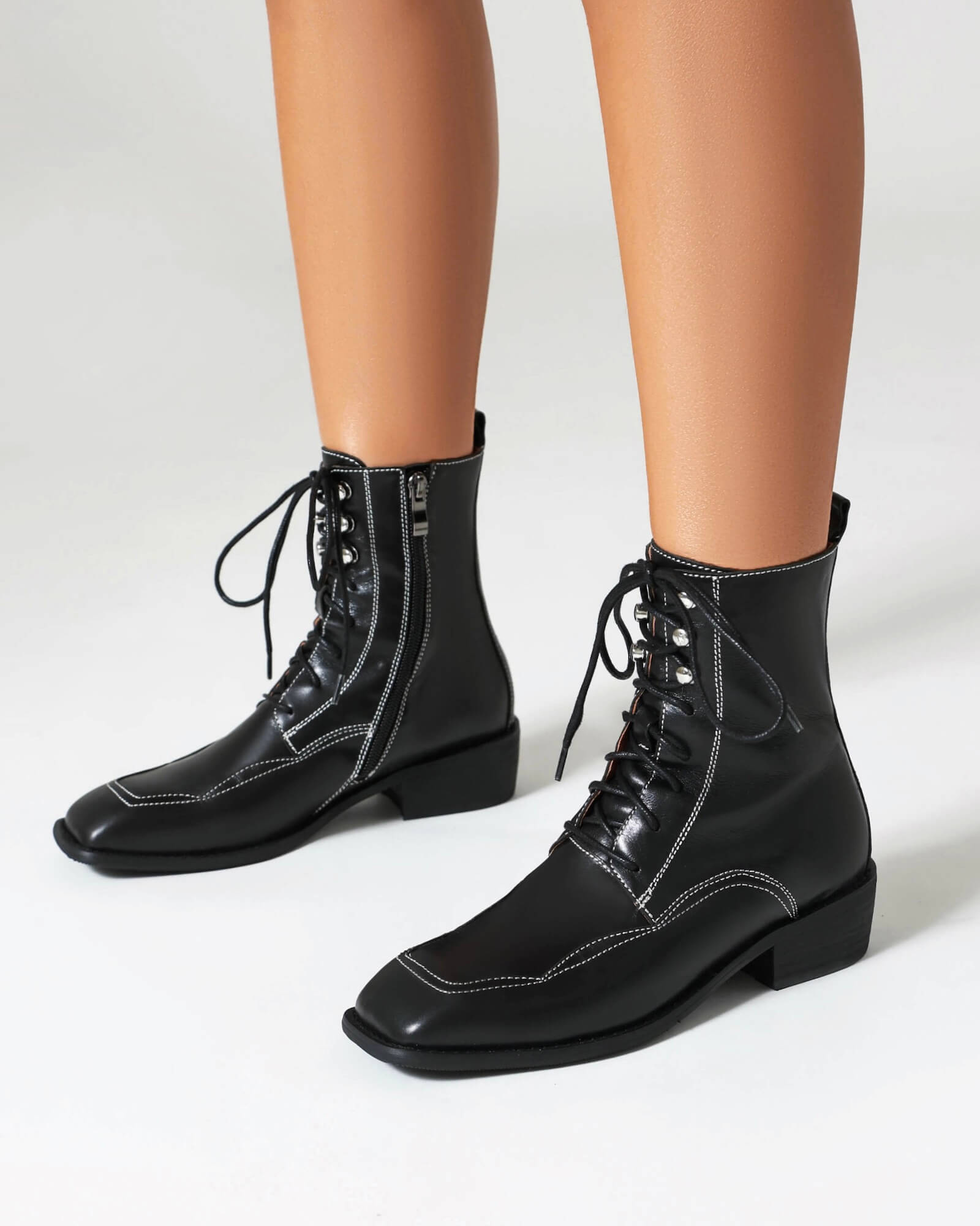 Foria-topstitching-leather-boots-model
